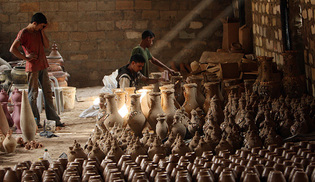 Palestinian workers in a Gaza pottery, 2008