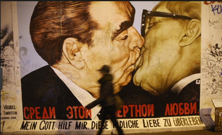 Image of Brezhnev, Soviet leader, passionately kissing Honecker, former East Germany leader