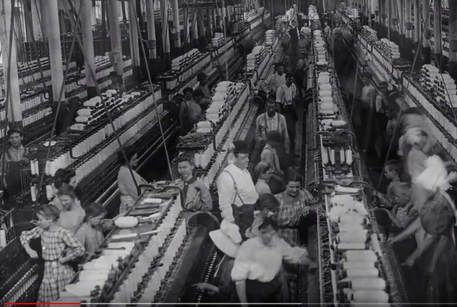 Still from 'Bread and Roses' video showing early 20th century textile factory