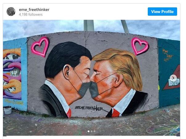 Mural showing Chinese President Xi Jinping and President Trump kissing through their face masks, obviously in love.s