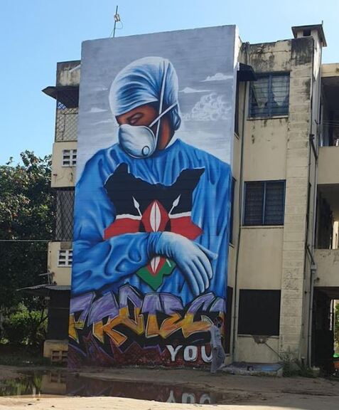 A large mural of a nurse in protective clothing, shown in Mombasa, Kenya, as a tribute to health workers caring for Covid-19 patients.